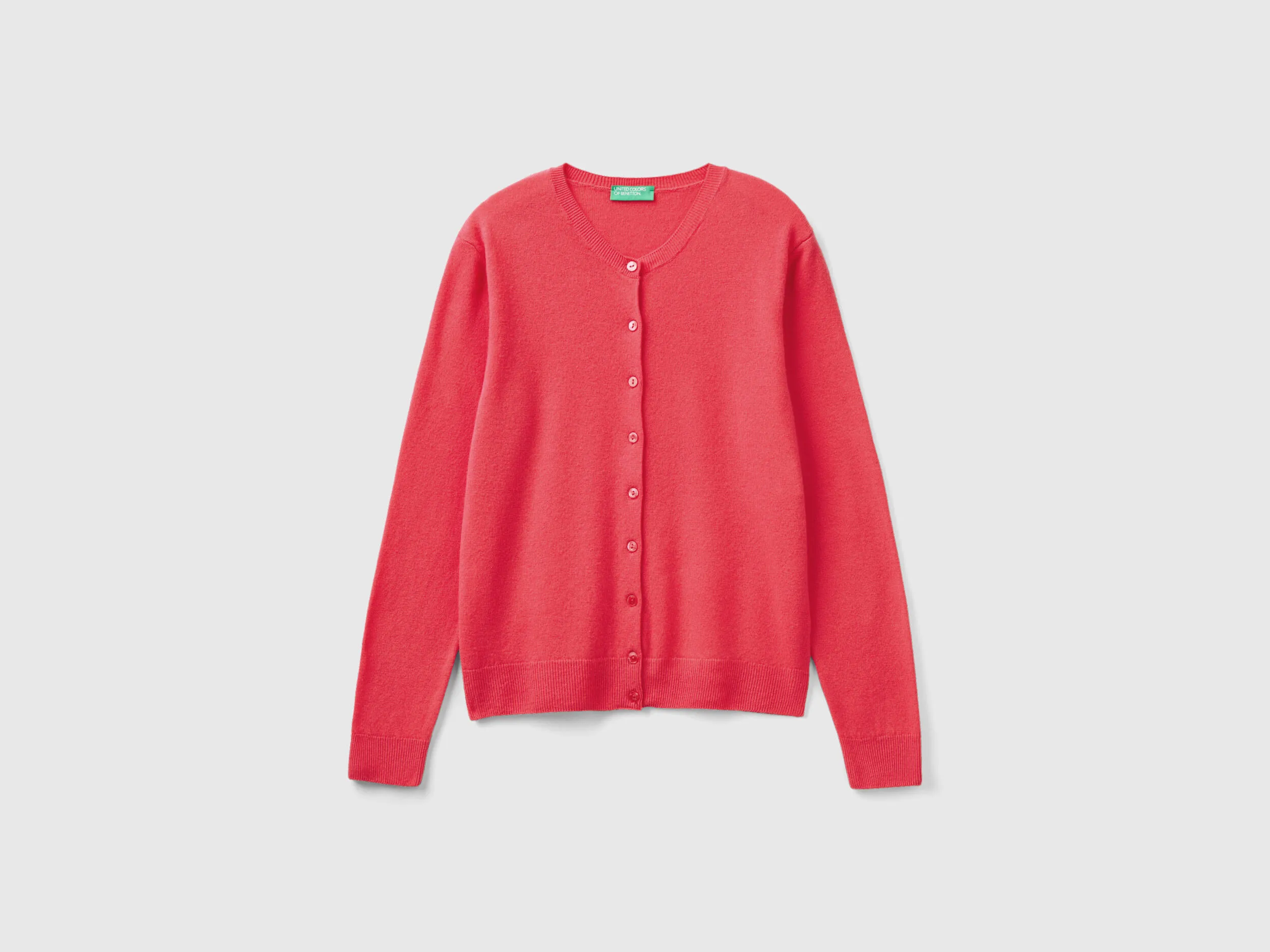 Cárdigan de cuello redondo fucsia de pura lana merina
